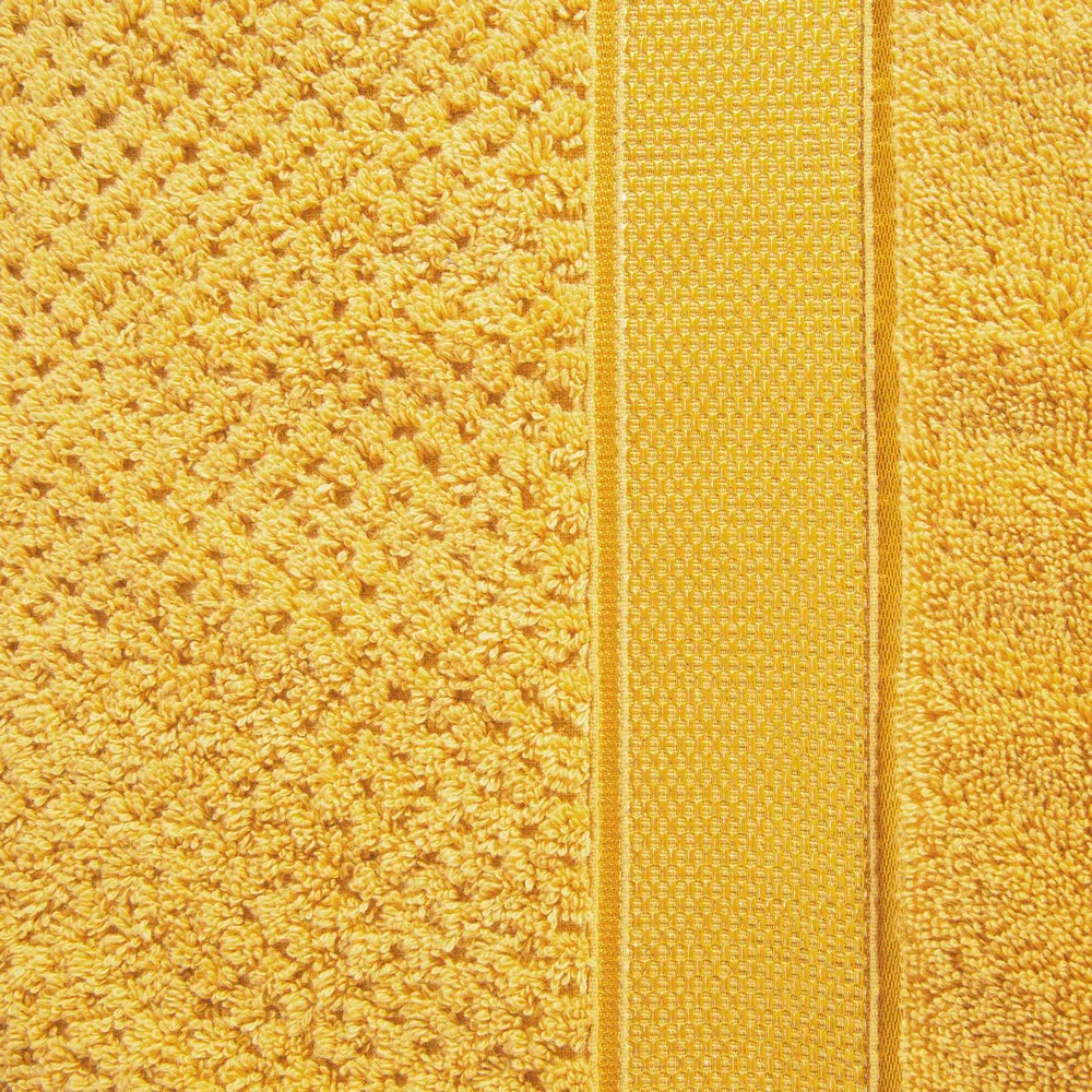 Ręcznik Milan 70x140 musztardowy frotte 500m/g2 bawełniany z bordiurą przetykaną błyszczącą nicią Eurofirany